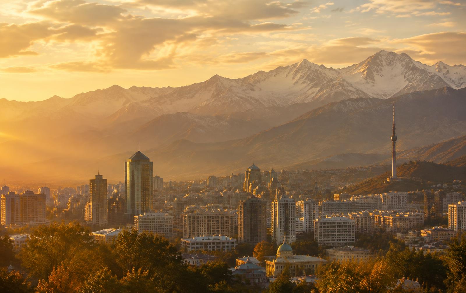 Almaty at golden hour beneath the mountains